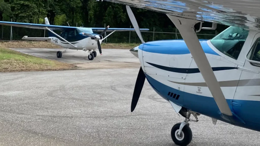 fly adventure air two airplanes on the ground